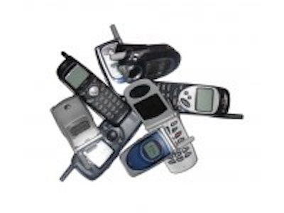 Piezoelectric kinetic energy harvester for mobile phones