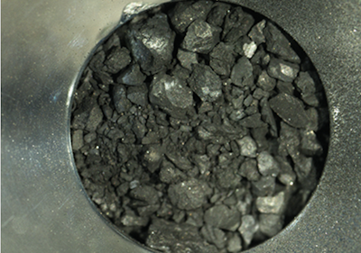 First Analysis of Rocks Plucked from Speeding Asteroid