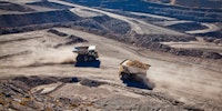 Two diesel-electric trucks used in modern mines and quarries for hauling industrial quantities of ore or coal. Used when extra torque is needed for steep hills. Blackwater, Australia. Logos removed.