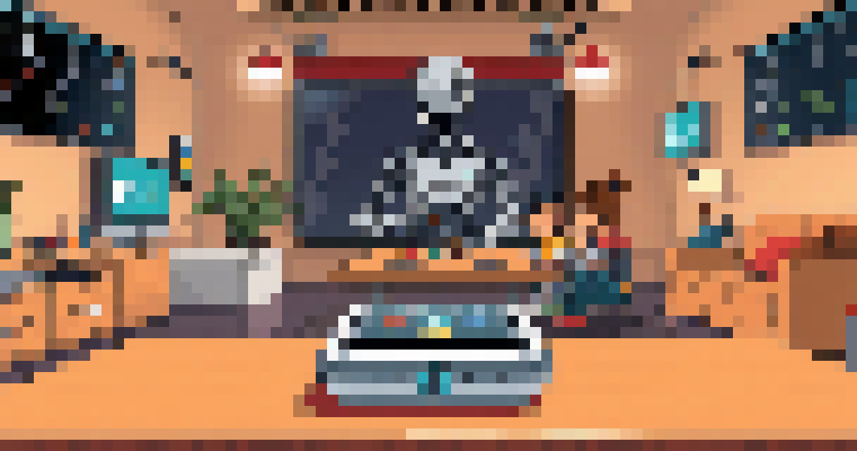A service robot is stood at a small table preparing a meal for two children sat to its left. They are chatting as they wait for their food.