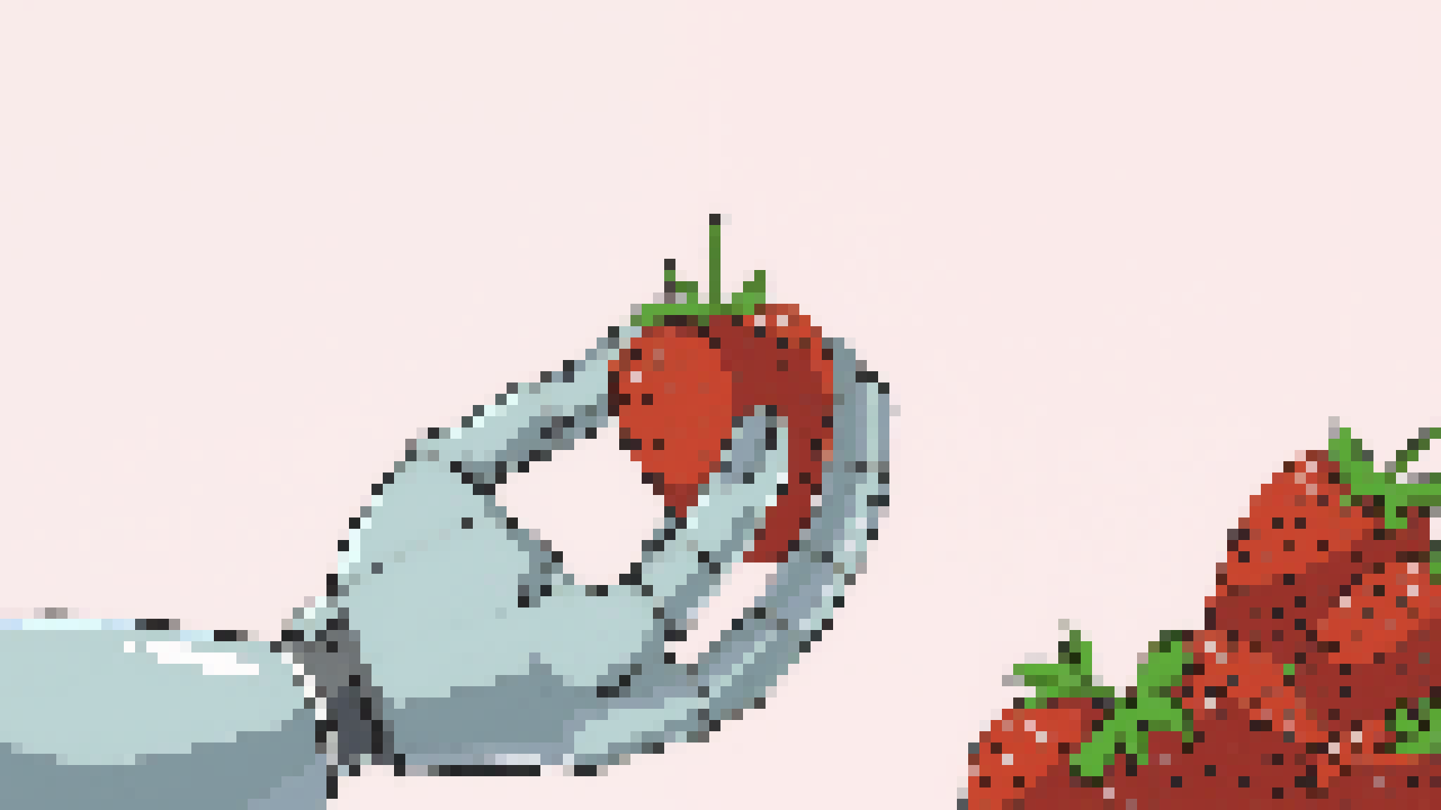 A robotic hand is holding a strawberry.
